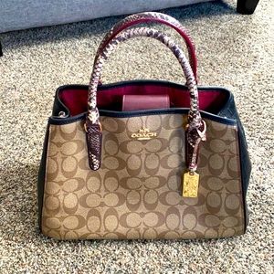 Coach handbag. Brown Coach leather with Burgundy accent.